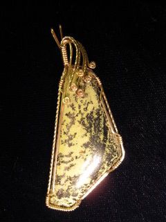 P-23 Pendant wrapped in 14 carat gold filled wire. Was told this stone was called 'chameleon,' but can't find any information on it $35.jpg